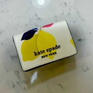 Kate Spade Small Patterned Lemon Wallet with several pockets